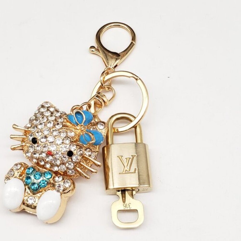 Louis Vuitton Gold Lock 🔒 Authentic LV Key + Unbranded Hello Kitty Bag Charm - Picture 4 of 7